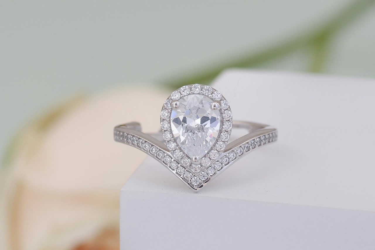 pear shape engagement ring with pave setting