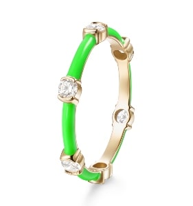 A gold ring features neon green enamel and diamond accents from Melissa Kaye.