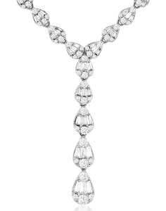 A lariat necklace from Kirk Signature features baguette diamonds. 