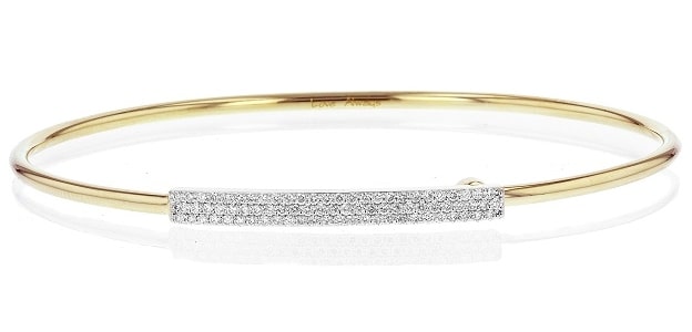 A thin gold bangle with a diamond bar from Phillips House.