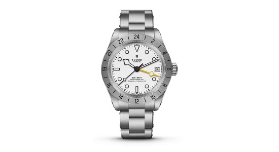 a sterling steel TUDOR Black Bay Pro watch with a white dial