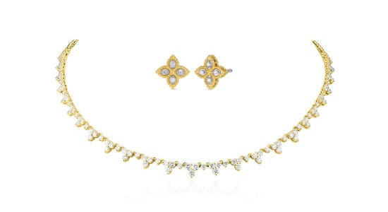 a yellow gold and diamond choker paired with a pair of floral diamond studs