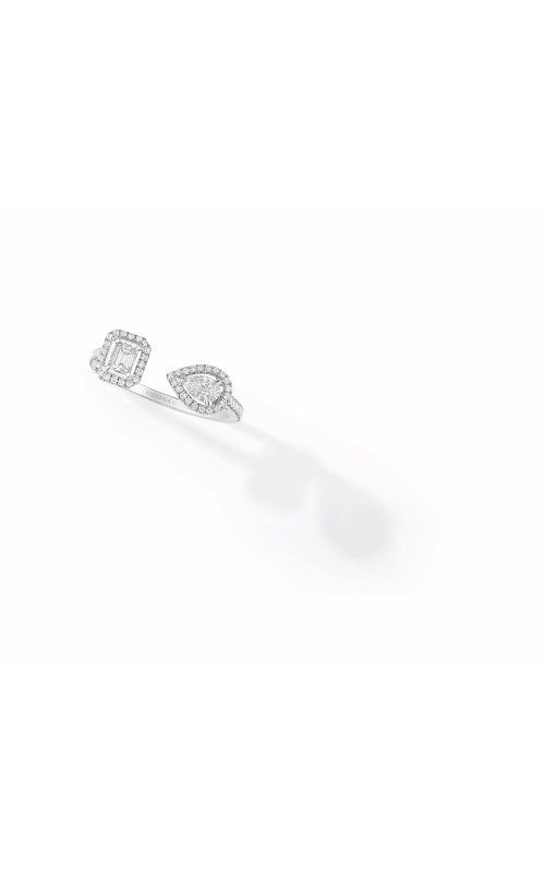 A white gold two-stone ring showcasing a pave-enclosed emerald-cut diamond on one end and a pear-cut diamond on the other.