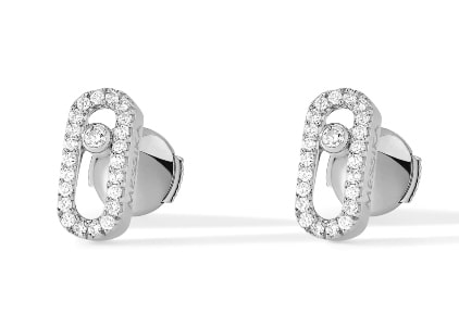 a Messika Move Uno stud earrings with round-cut diamond accents.