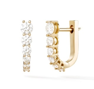 A pair of diamond huggie earrings from Melissa Kaye’s Aria collection.