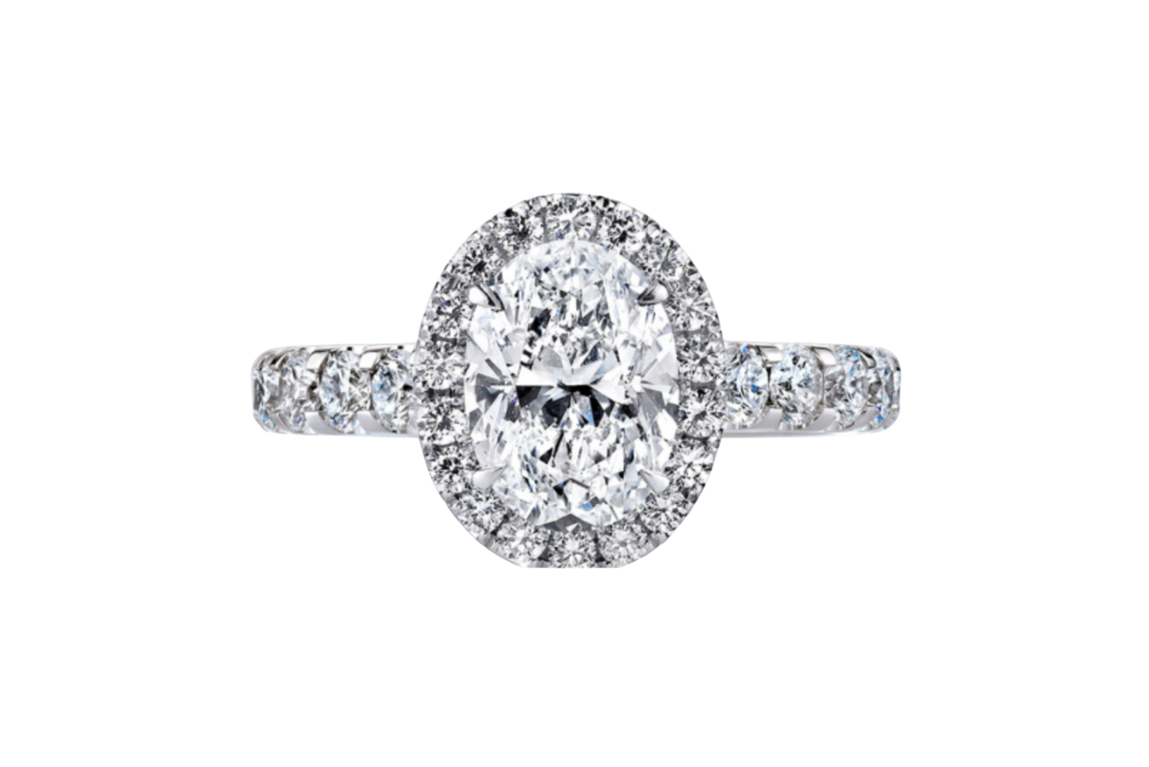 A dazzling halo engagement ring with an oval center stone.