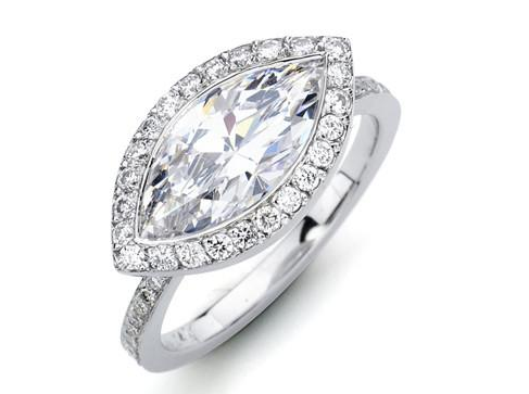 A white gold marquise cut diamond halo engagement ring.