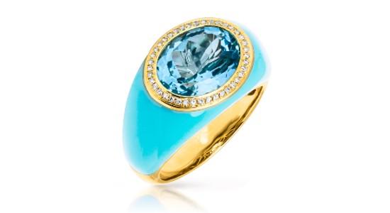a yellow gold and blue enamel fashion ring featuring an oval cut blue topaz