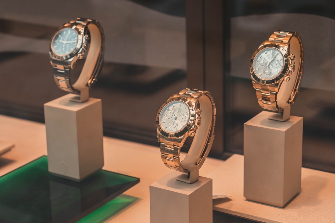 Three luxury timepieces on display