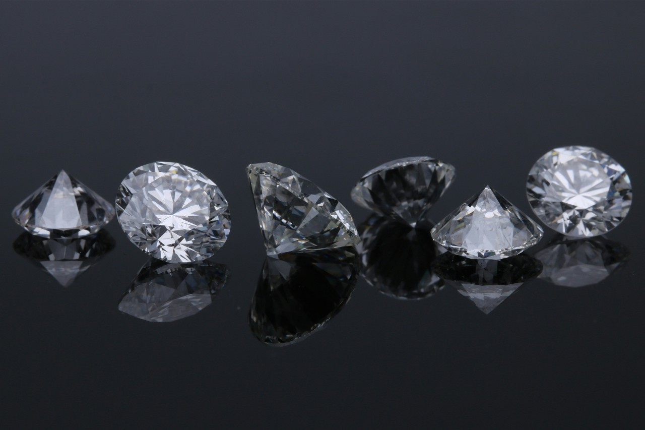 a row of diamonds on a black background