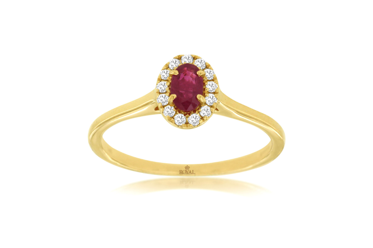 A yellow gold ring with an oval ruby gemstone and a diamond halo.