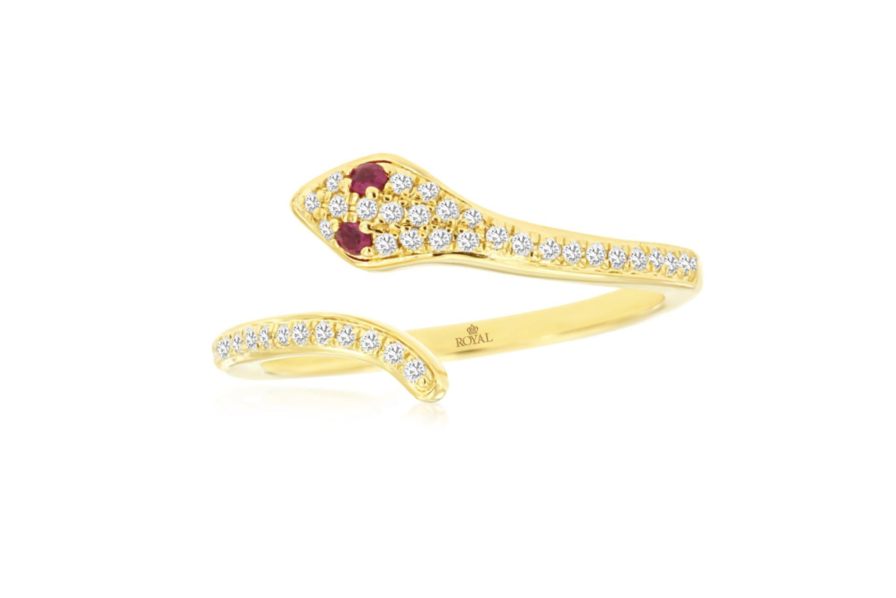 A yellow gold snake ring with diamonds all throughout and two ruby eyes.