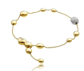 A Chimento bracelet features gold bubble shapes with a diamond-adorned bubble.