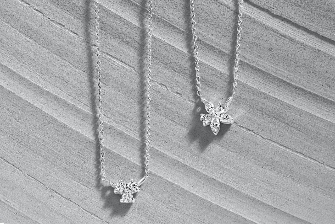 a pair of platinum necklaces