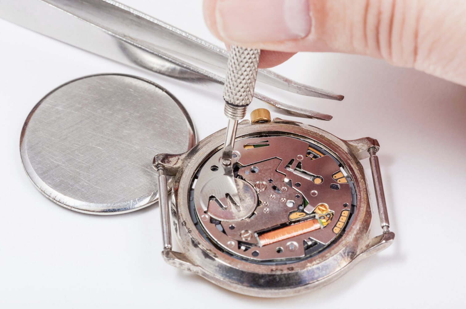 A watch expert working on the inner workings of a watch.