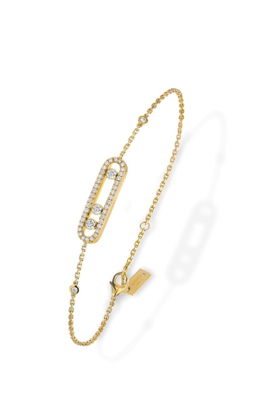 A gorgeous yellow gold chain bracelet featuring bezel-set diamonds.