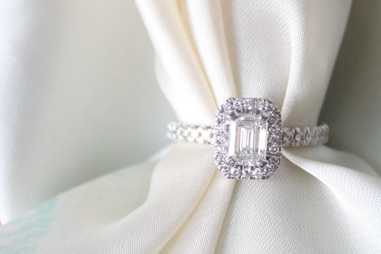 diamond engagement ring wrapped around a white cloth