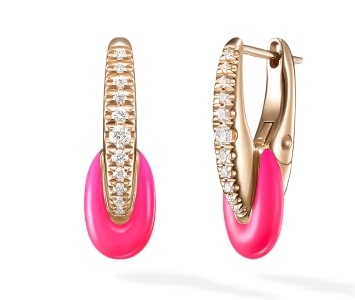 A pair of neon pink enamel huggies earrings from Melissa Kaye.