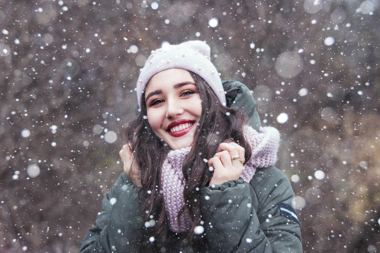a lady wearing jewelry in the snow