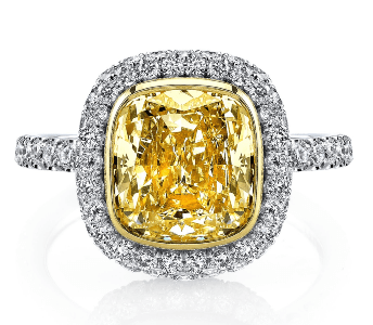 A yellow diamond halo engagement ring from Kirk Couture.