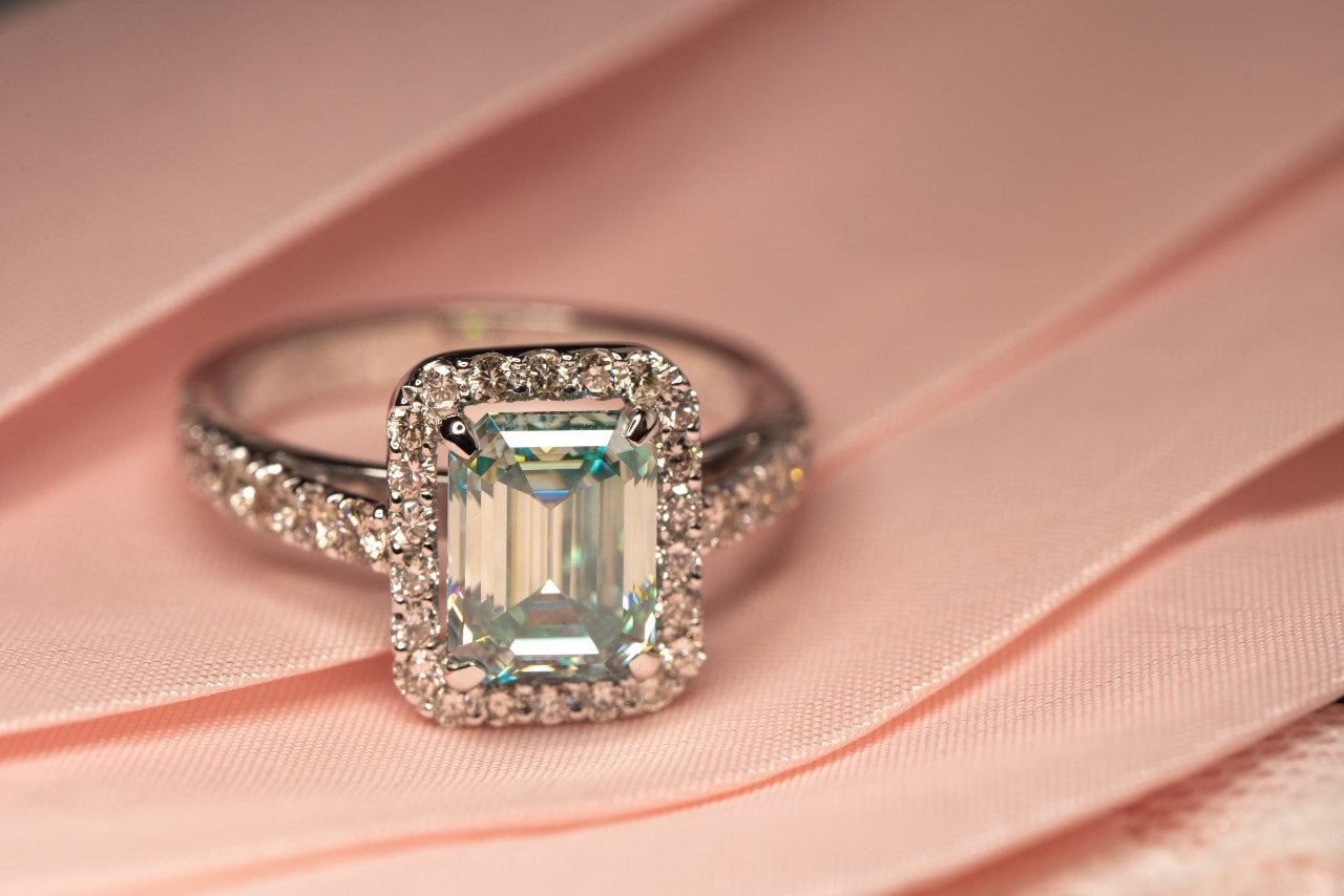 Diamond engagement ring on a pink background